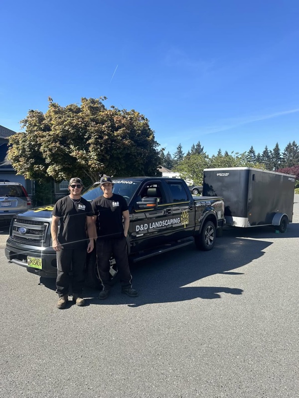 Dylan and Dominic standing in front of D&D Landscaping truck